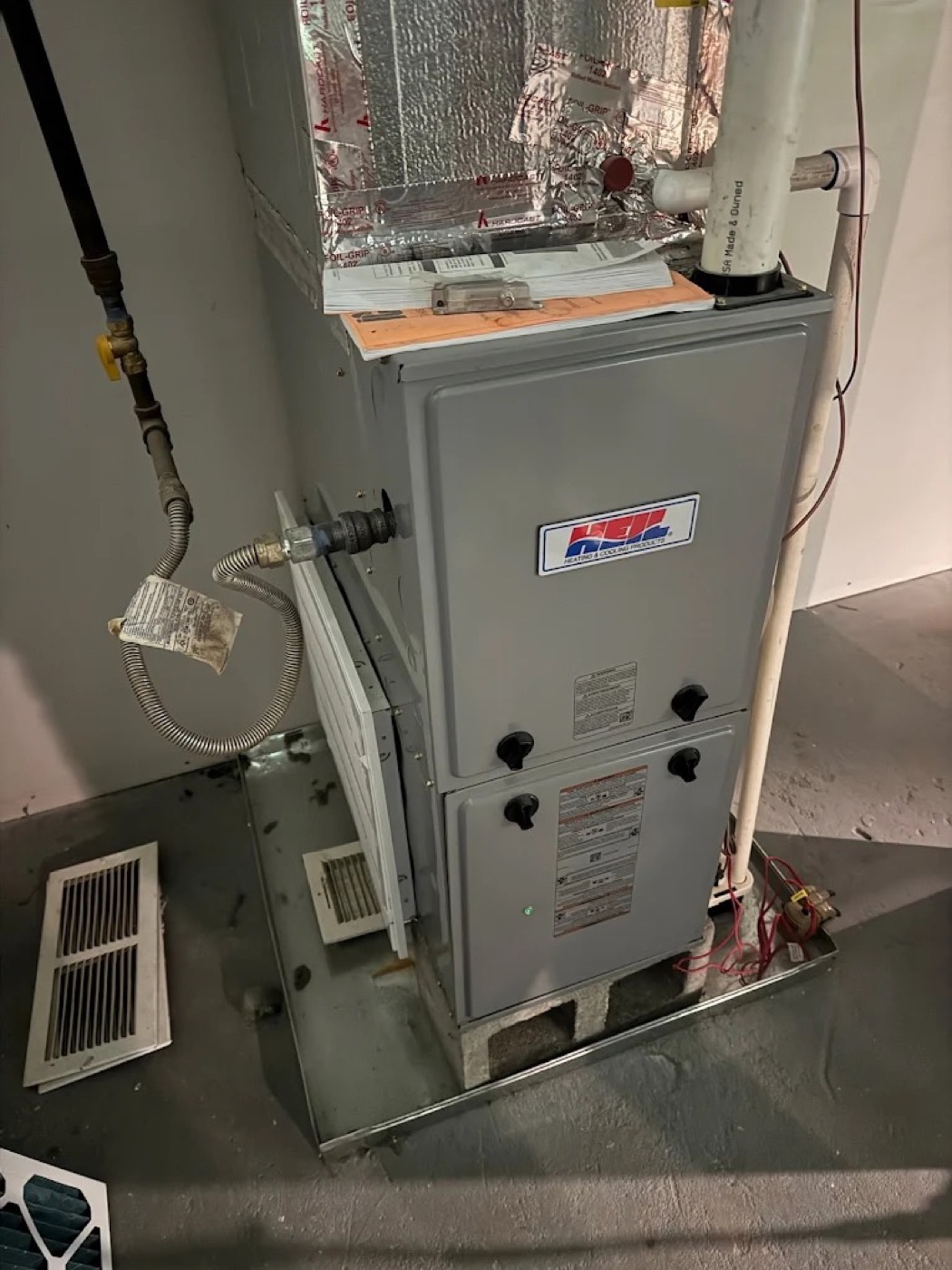 Rheem gas furnace installed by Dynasty in a basement utility room